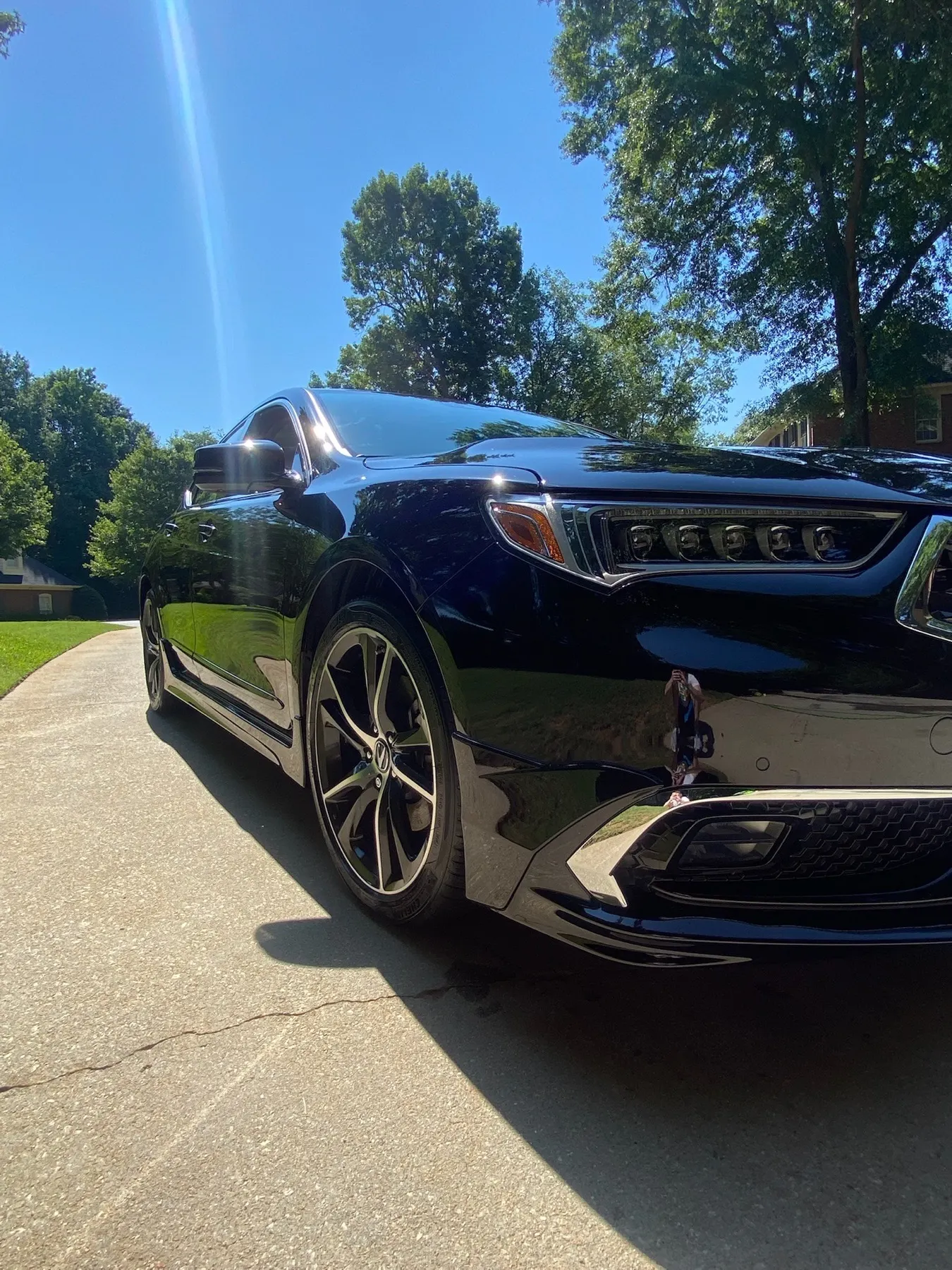 Finished black Acura TLX after exterior detailing